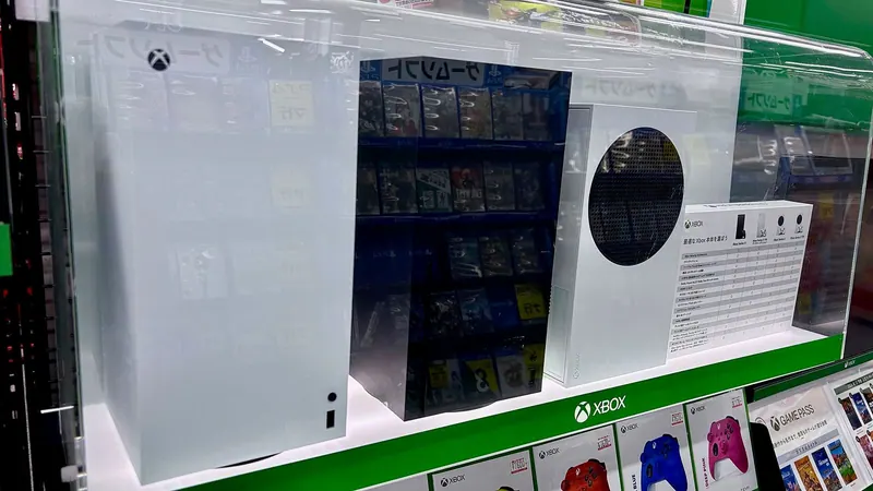 Современная игровая консоль Xbox с геймпадом на рабочем столе