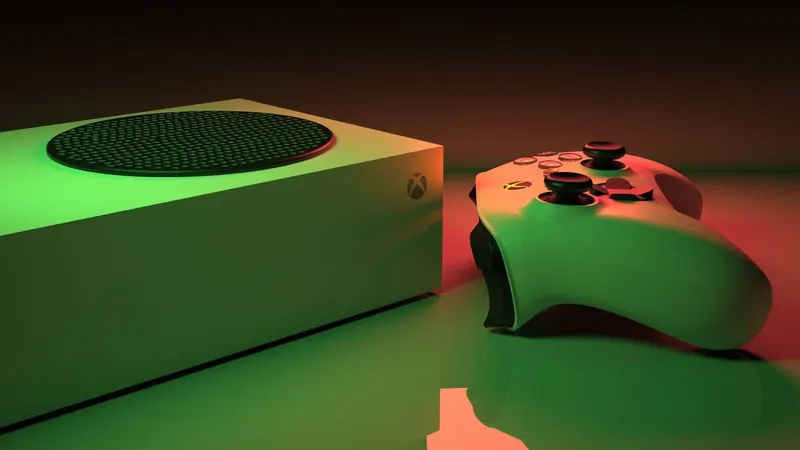 Консоль Xbox и игровой диск на столе